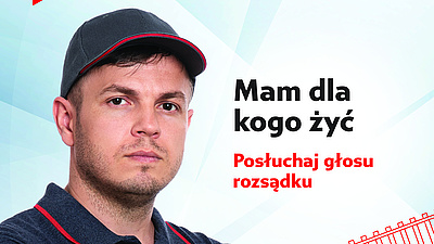 Mężczyzna i napis - Mam dla kogo żyć. Posłuchaj głosu rozsądku.